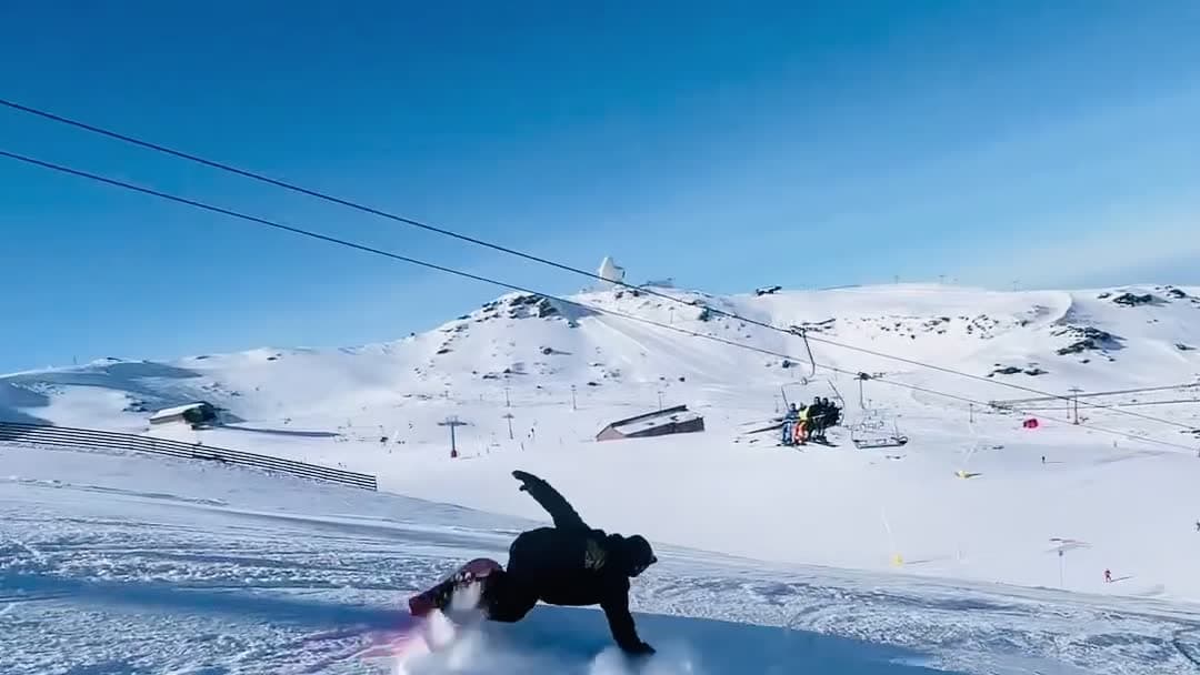 Snowboarder carving a turn on a slope in Sierra Nevada